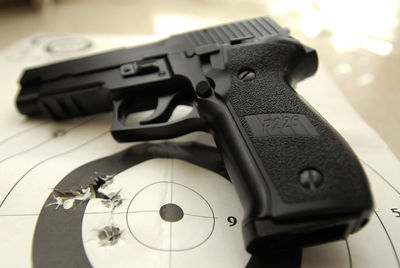 Close-up of gun on sports target