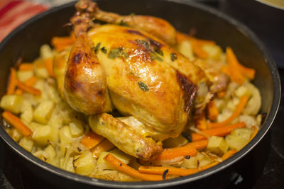 Close-up of roast chicken in kitchen utensil