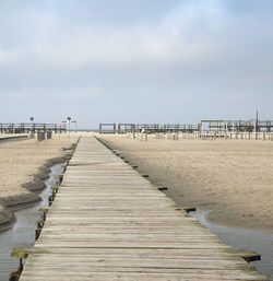 Pier over sea against sky
