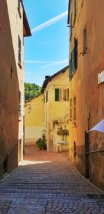 Narrow alley amidst buildings in town