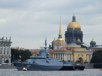 View of cathedral in city against cloudy sky