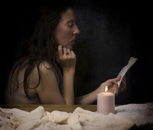 Woman in romantic attitude reading a love letter iii