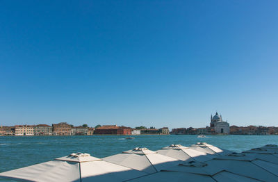 View of buildings in venice city against clear blue sky
