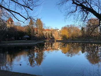 Reflection of trees in lake against sky during autumn