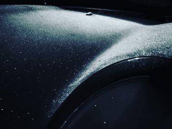 Close-up of illuminated car on snow