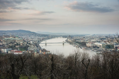 High angle view of bridge over river against cloudy sky