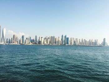 Sea with city in background