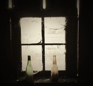 Close-up of bottle against window