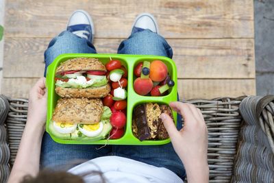 Low section of woman eating food