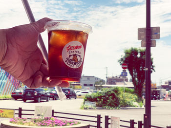 Close-up of hand holding glass