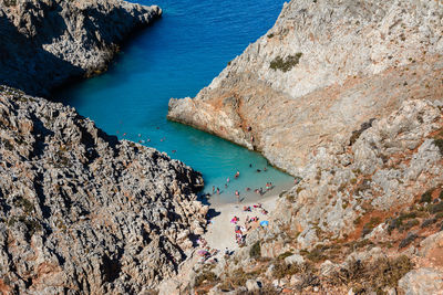 High angle view of rocks on sea shore