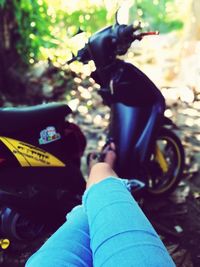 Low section of people sitting outdoors