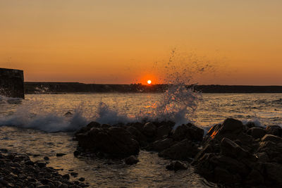 Scenic view of sea against sky during sunset