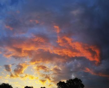 Low angle view of dramatic sky during sunset