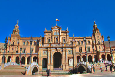 Facade of historic building against blue sky
