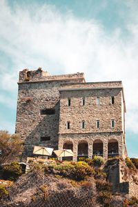 Low angle view of old ruins against sky