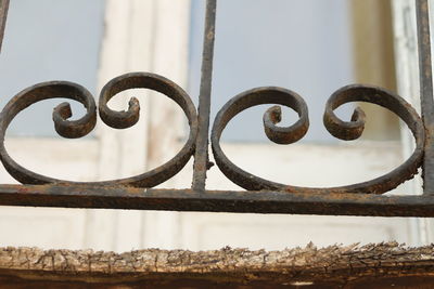 Close-up of rusty metal against sky