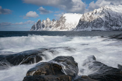 Scenic view of sea and rocks against sky