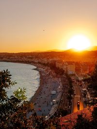 High angle view of city buildings during sunset