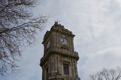 Low angle view of clock tower against sky