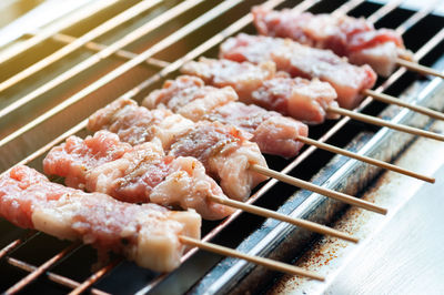 High angle view of meat on barbecue grill