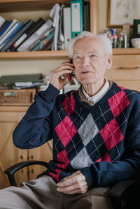 Portrait of man sitting at home