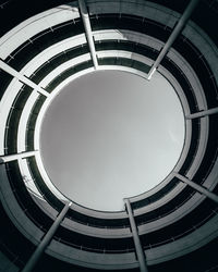 Low angle view of spiral staircase of building against sky