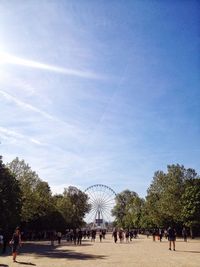 People at jardin des tuileries against sky