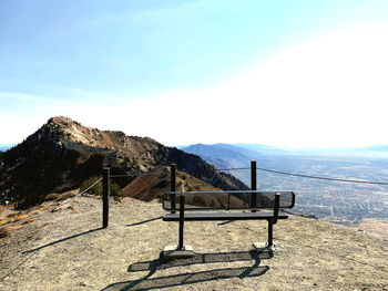 Willard  peak bench awaits you in the sunlight.