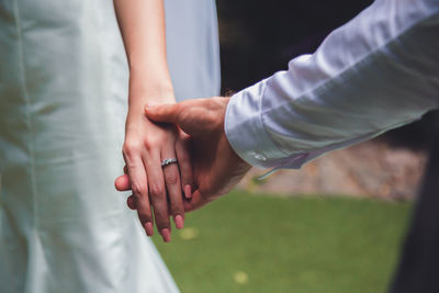 Bouquet in the hands of the groom. to make a happy wedding gift to a young bride.