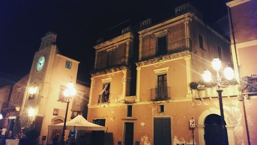 Low angle view of illuminated street light at night