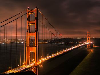 View of suspension bridge at sunset