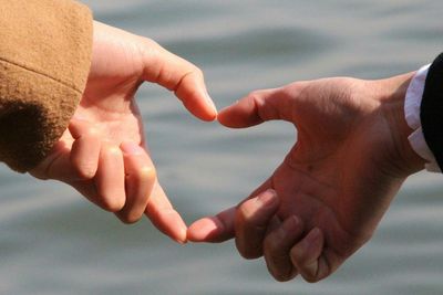 Close-up of couple holding hands