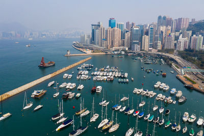 High angle view of commercial dock and sea against sky