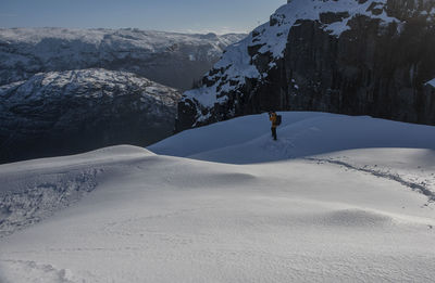 Man skiing on snowcapped mountain