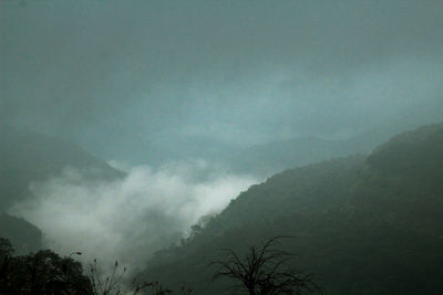 Scenic view of tree mountains against sky