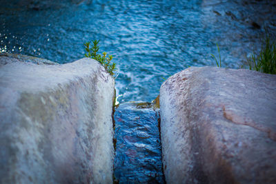 High angle view of rocks by sea