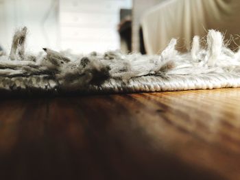 Close-up of rope on hardwood floor at home