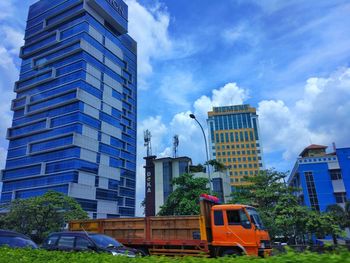 Skyscrapers in city against sky