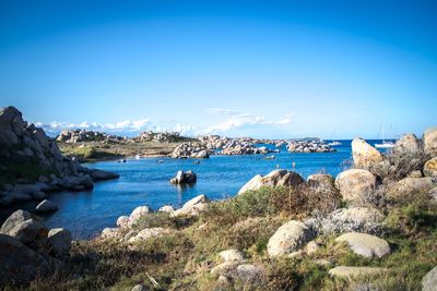 Scenic view of sea against blue sky