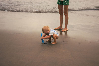 Little boy playing on the beach