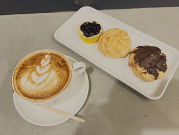 High angle view of cappuccino on table