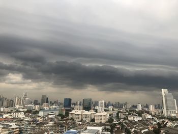 Buildings in city against sky