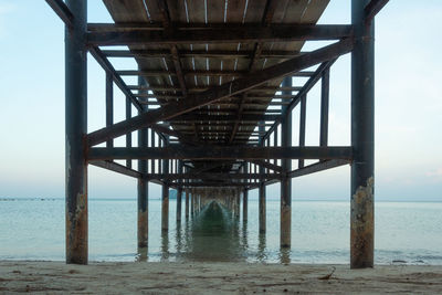 Pier over sea against sky