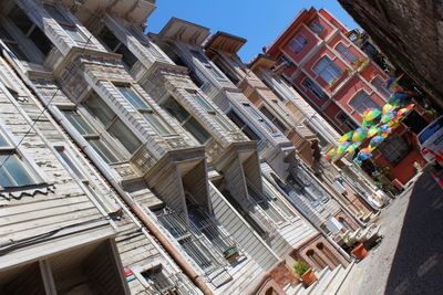 Low angle view of buildings in city against sky
