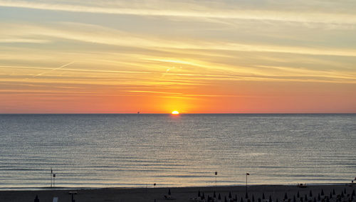 Orange dawn over mediterranean sea in summer. for travel and naturalistic concept