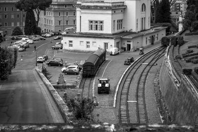 High angle view of railroad tracks by road in city