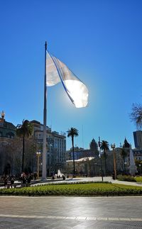 Low angle view of buildings against clear blue sky