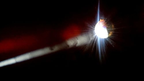 Low angle view of illuminated light against the sky