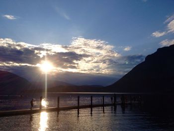 Scenic view of river against sky during sunset